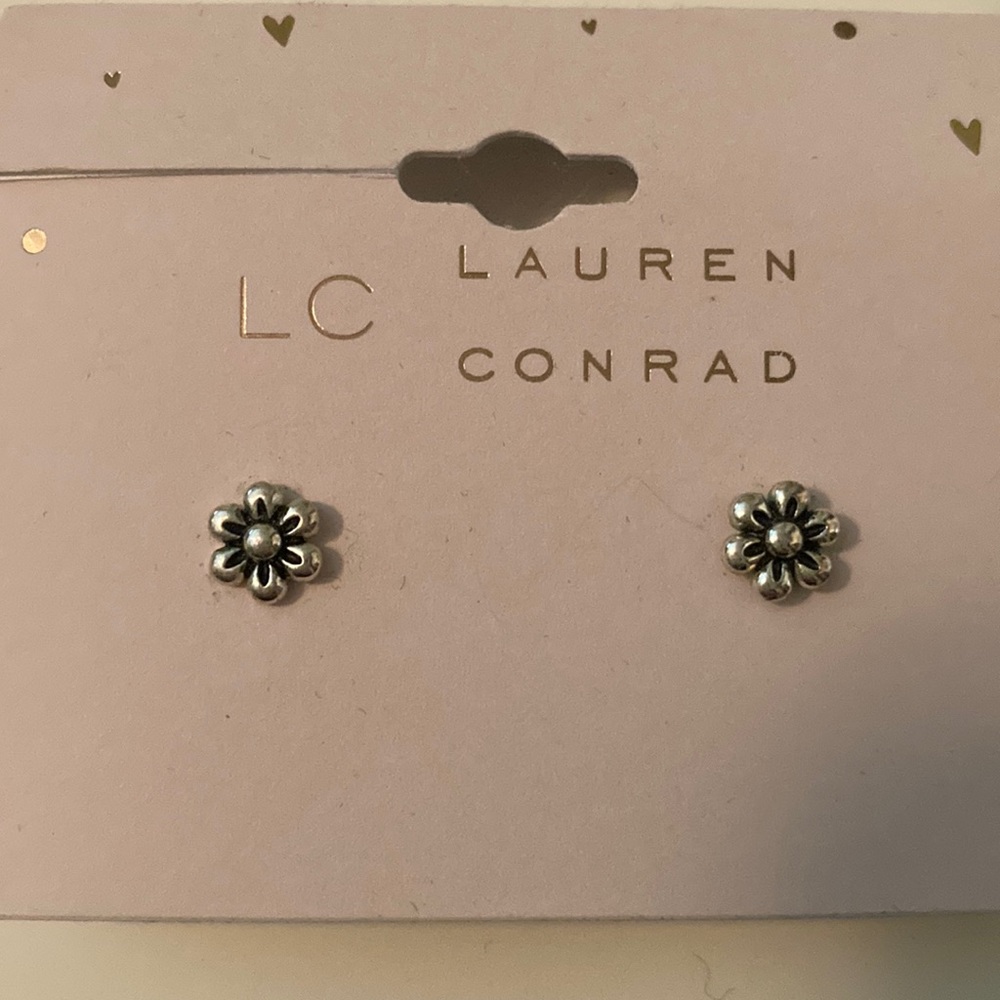 Post earrings - silver and look like a flower. Wore one time